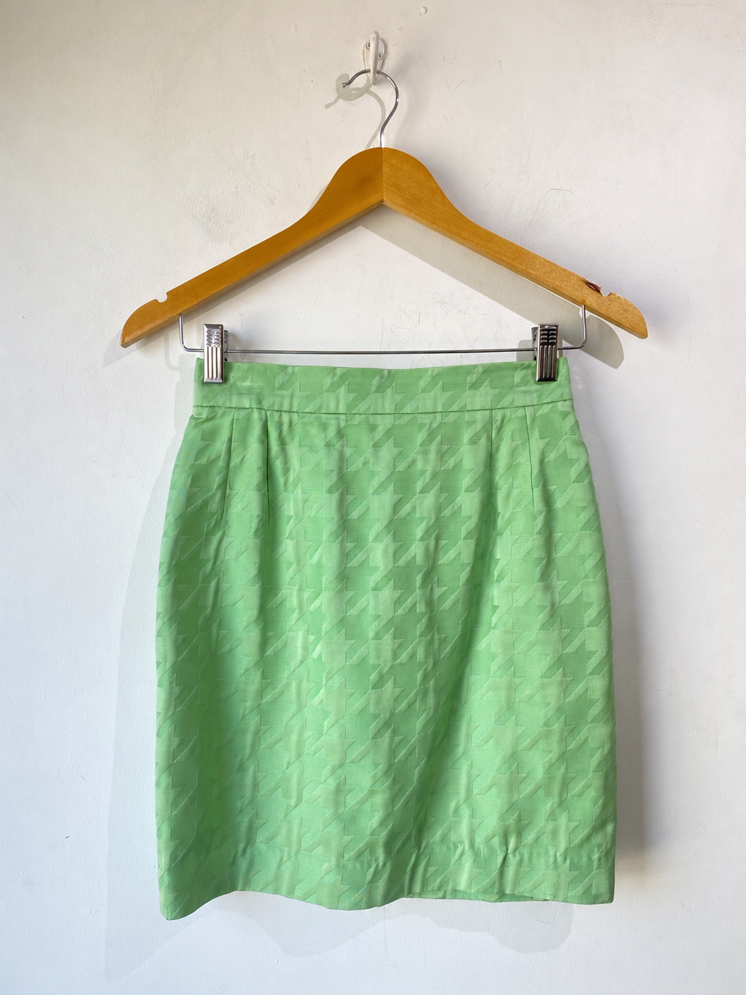 Matching pistachio green houndstooth mini skirt, front