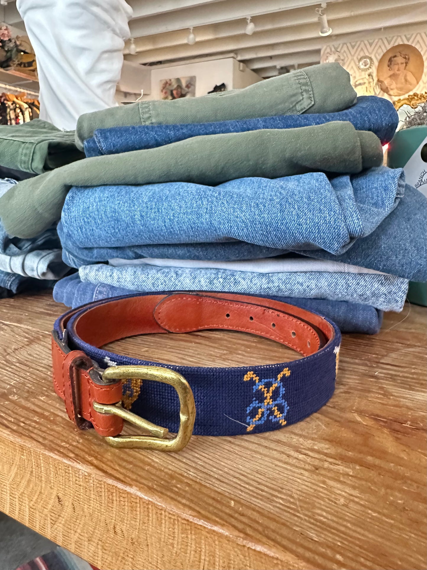 Beautiful hand-stitched navy needlepoint belt with a warm brown leather, by Smathers & Branson. 