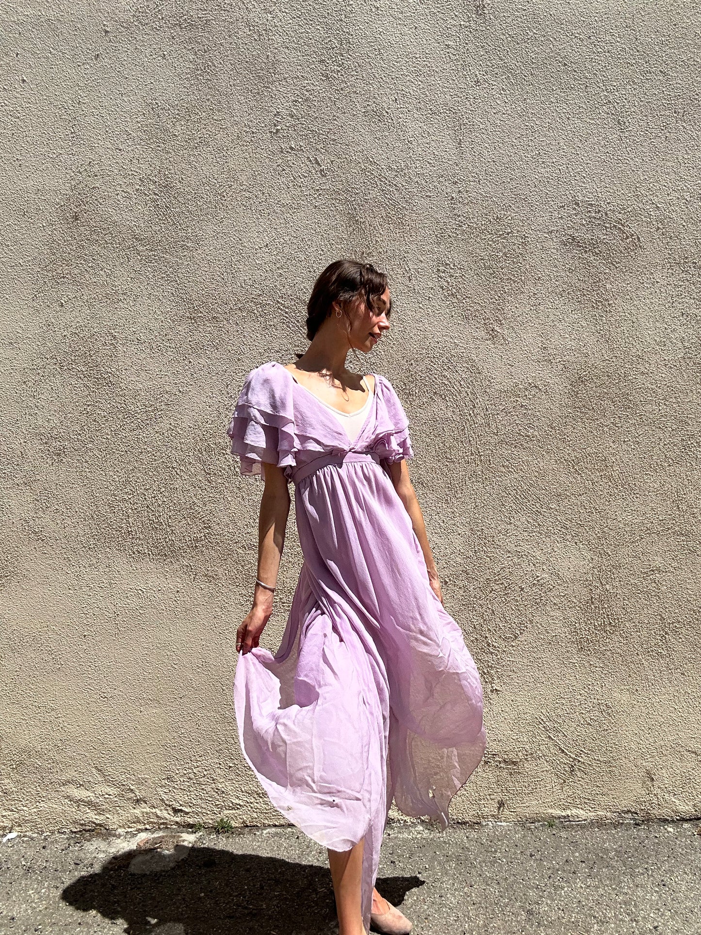 Close-up of a label on a piece of gray fabric with a visible brand logo.