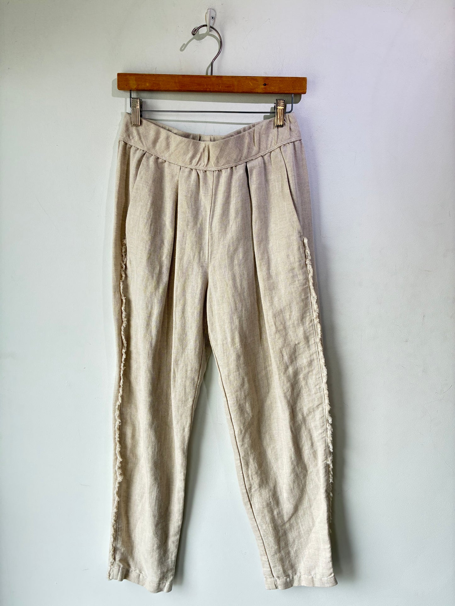 Raquel Allegra Pleated Oatmeal Herringbone Linen Pants with raw, frayed edges