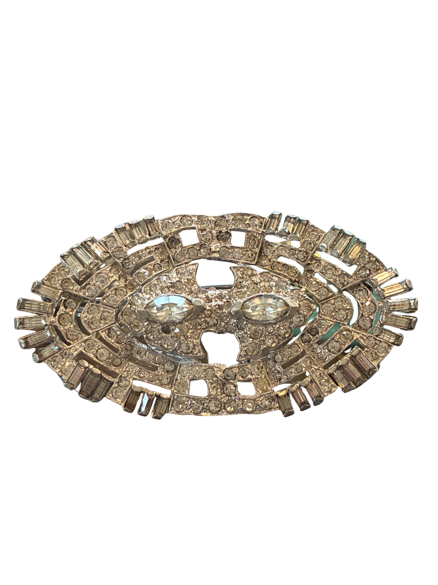 Decorative brooch with gemstones on a white background